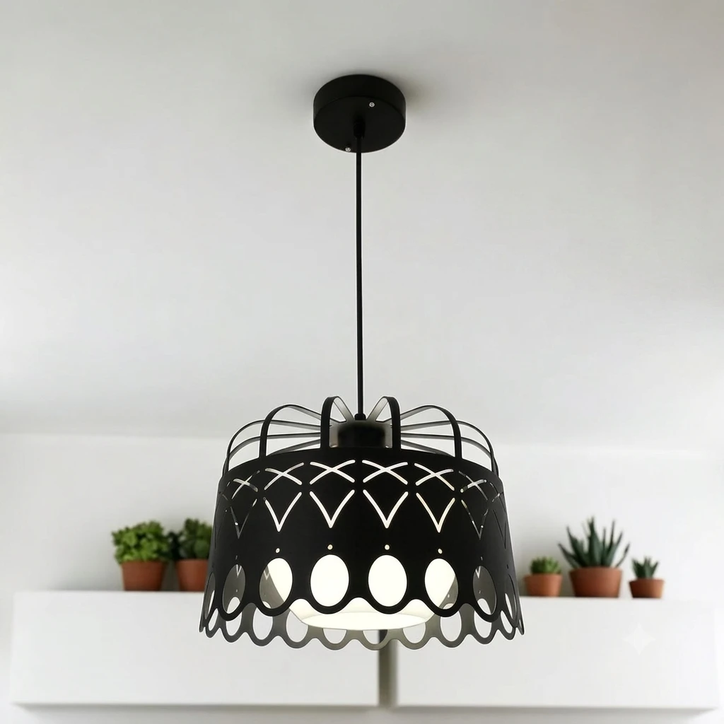 Black metal pendant light features a distinctive patterned cut-out design and a decorative bottom edge