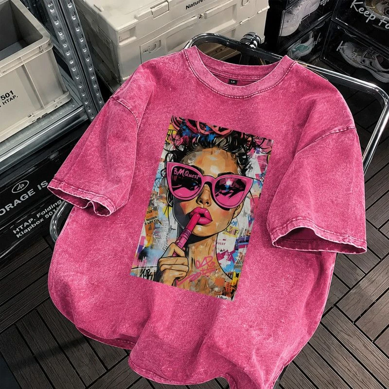 vintage-washed pink women's t-shirt featuring a bold pop art graphic