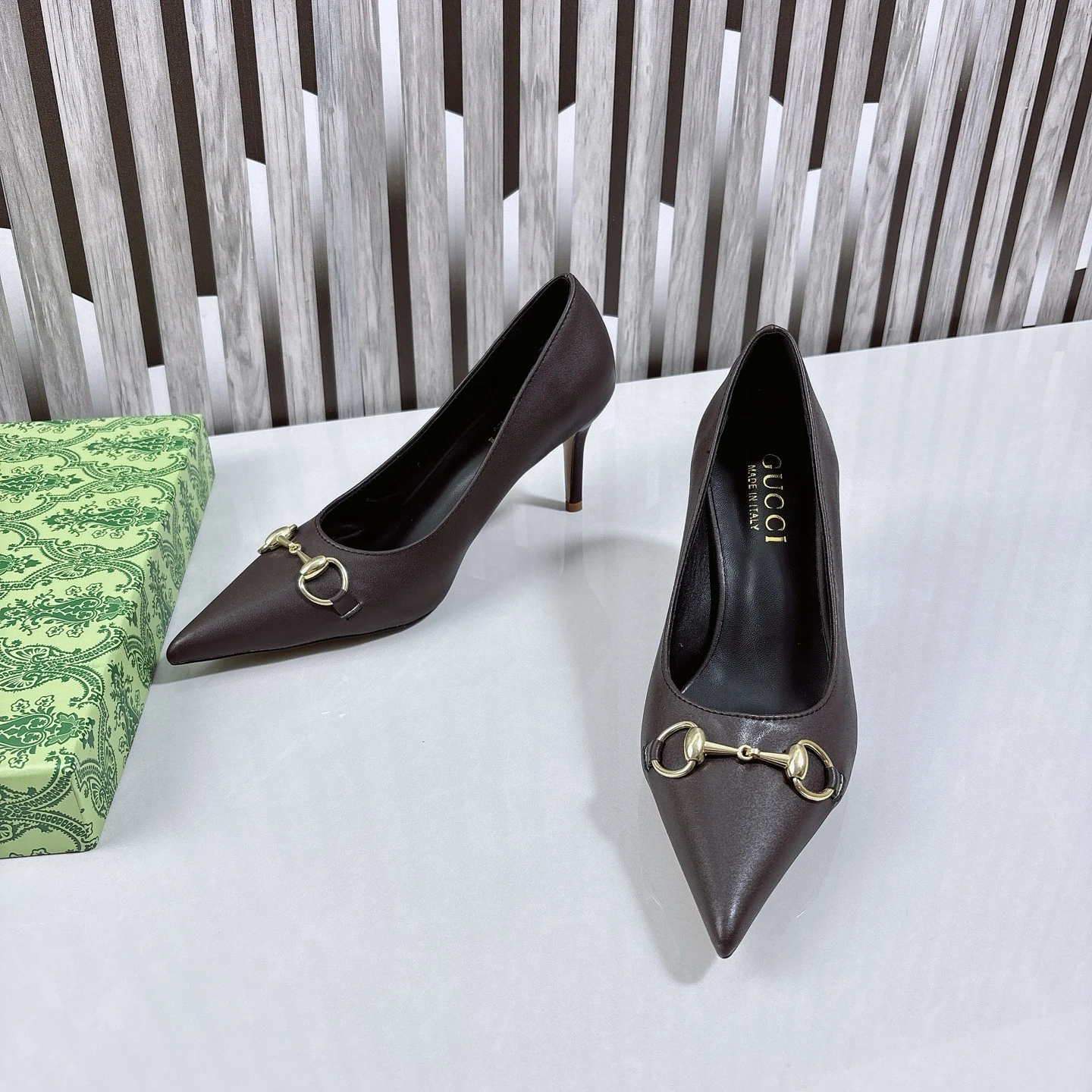 Gucci Women's Donna pump in dark brown leather featuring a pointed toe, stiletto heel